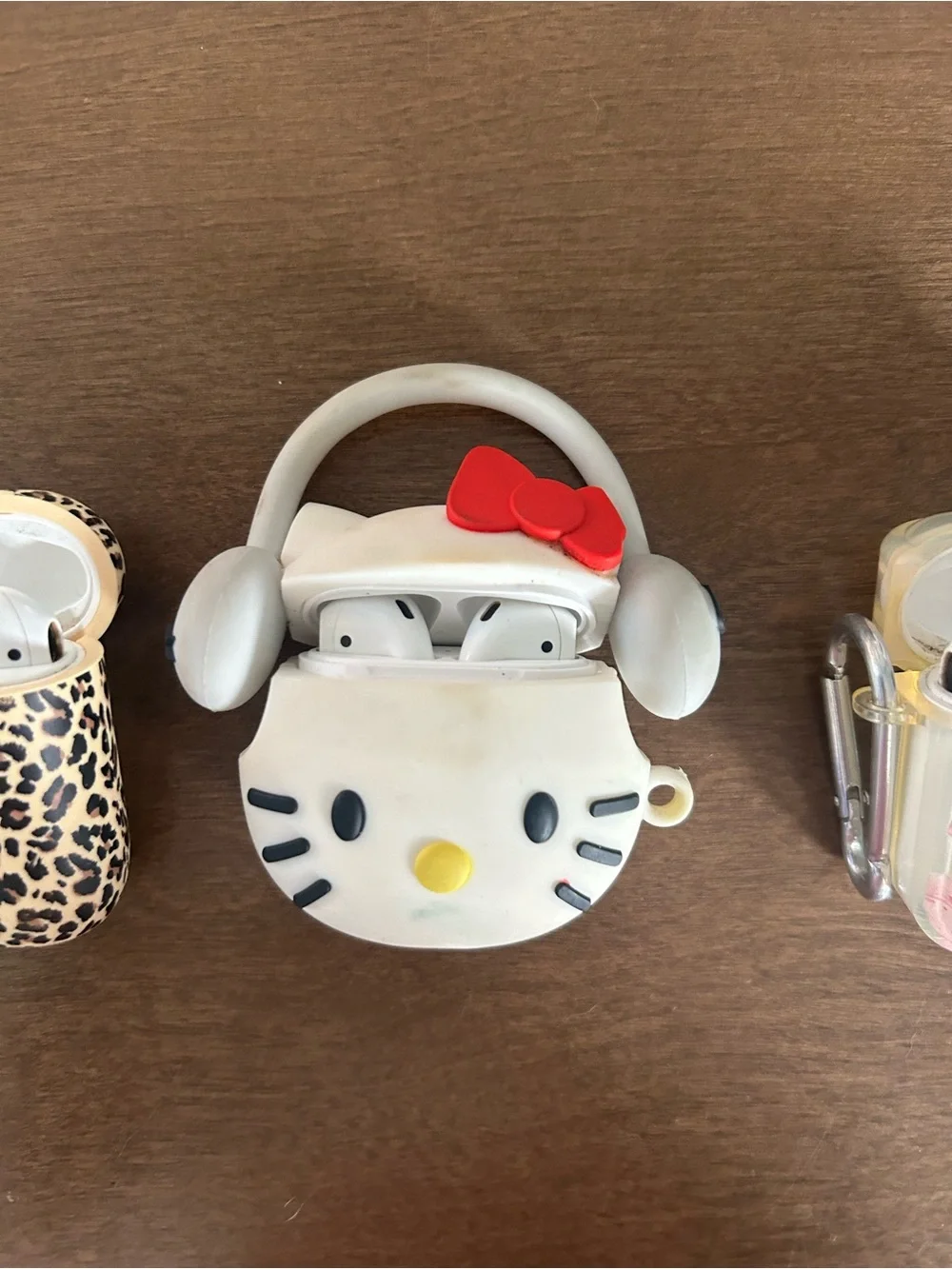 3 pairs of airpods with cases